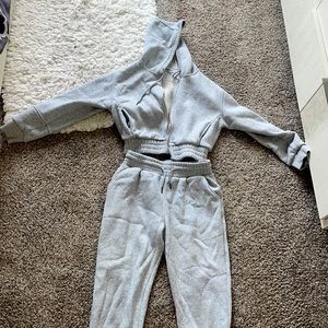 Two piece gray jumpsuit with cropped zip up hoodie